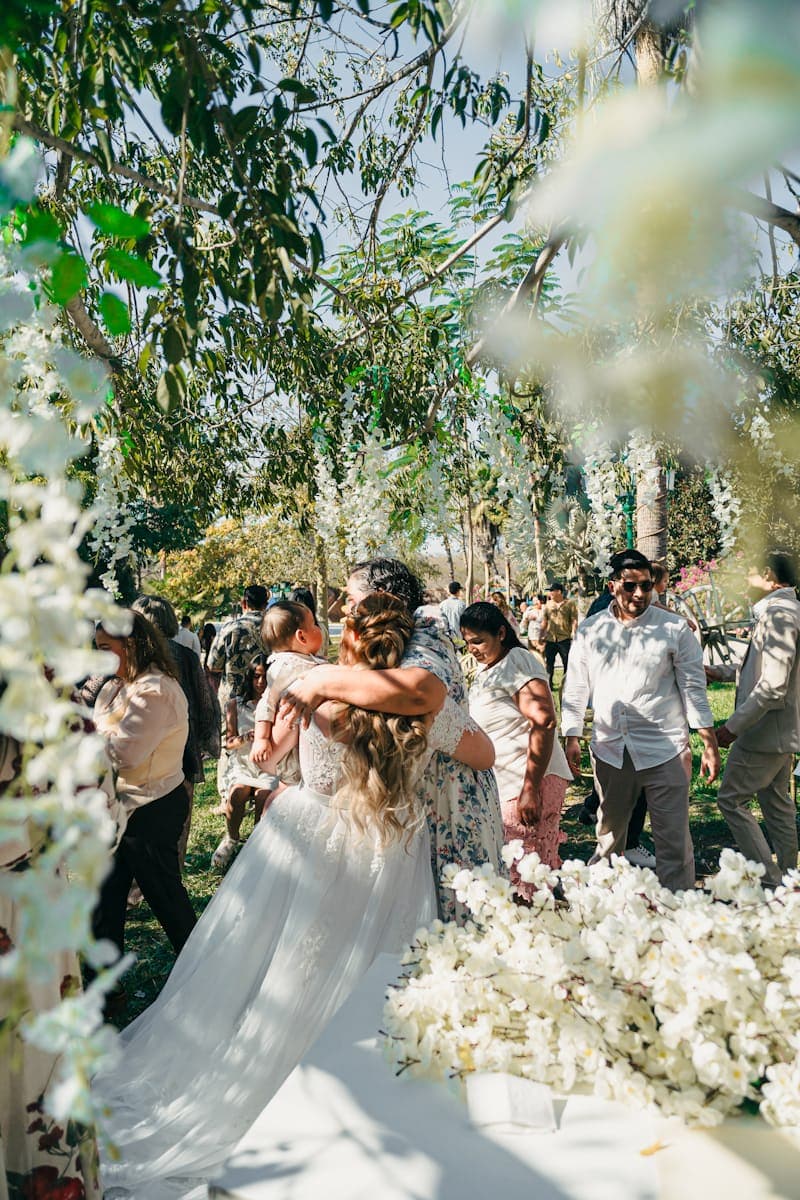 Bride embracing a child at the ceremony