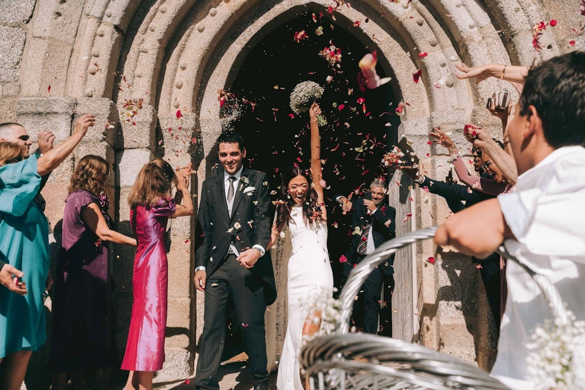 Wedding guests celebrating on the dance floor while photos are captured from every angle