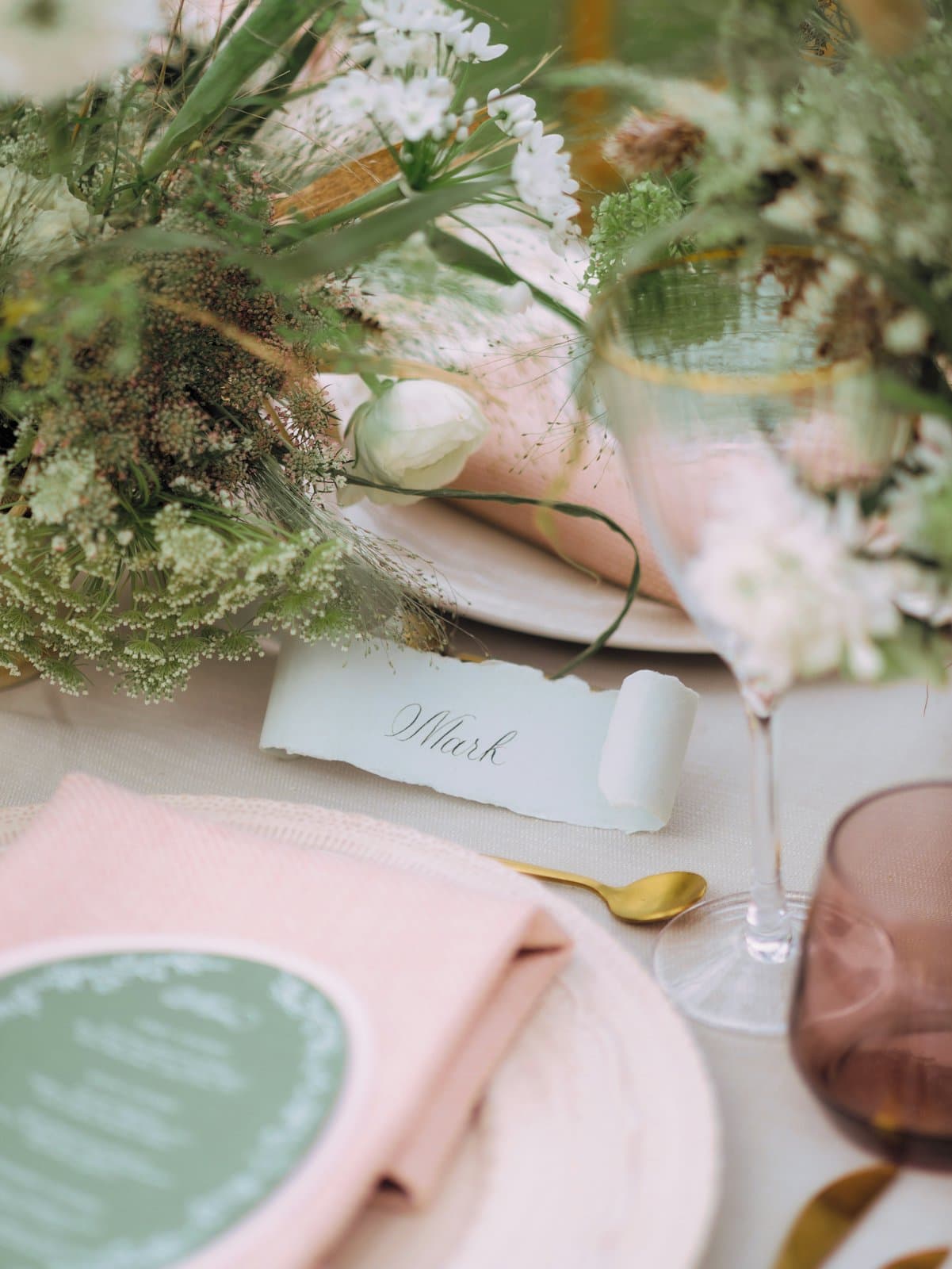 A wedding table card printed with a QR code for guests to scan and upload their photos